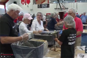 Volunteers in St. Louis Pack Meals for Haiti
